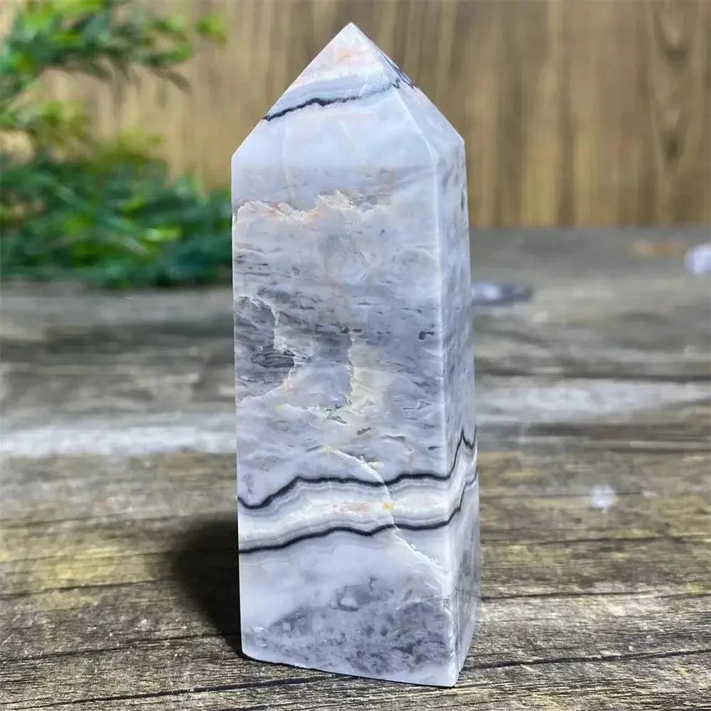 Picasso Stone Crystal Tower, a grounding root chakra stone with unique black brushstrokes on a cream and tan base.