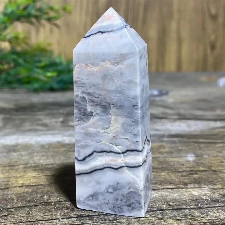 Picasso Stone Crystal Tower, a grounding root chakra stone with unique black brushstrokes on a cream and tan base.