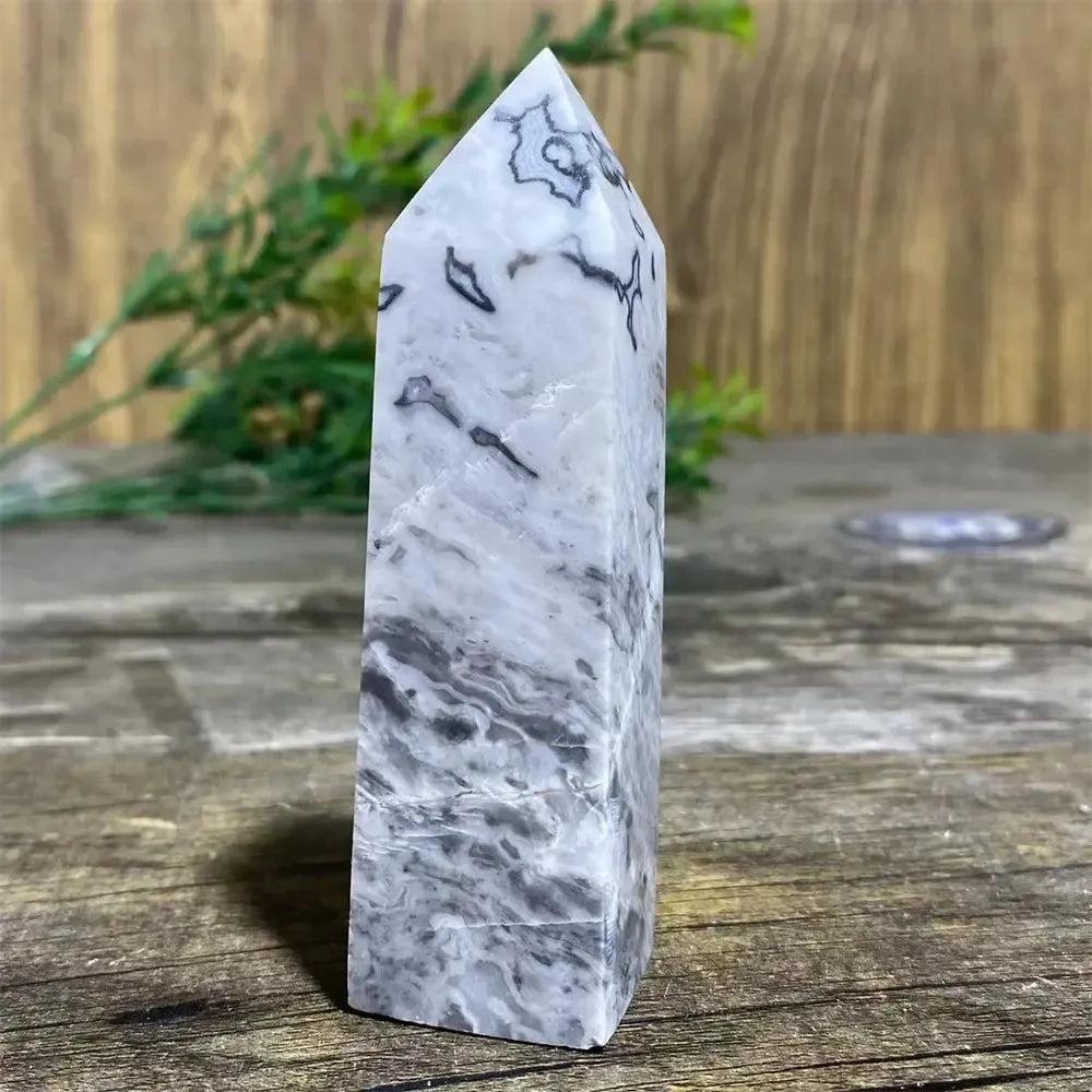 Picasso Stone Crystal Tower: grounding root chakra stone with bold black brushstrokes on warm cream.