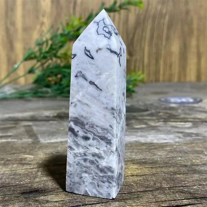 Picasso Stone Crystal Tower: grounding root chakra stone with bold black brushstrokes on warm cream.