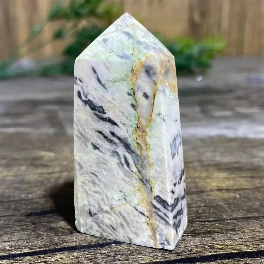 Picasso Stone Crystal Tower: grounding root chakra stone with bold black brushstrokes on warm cream and tan.