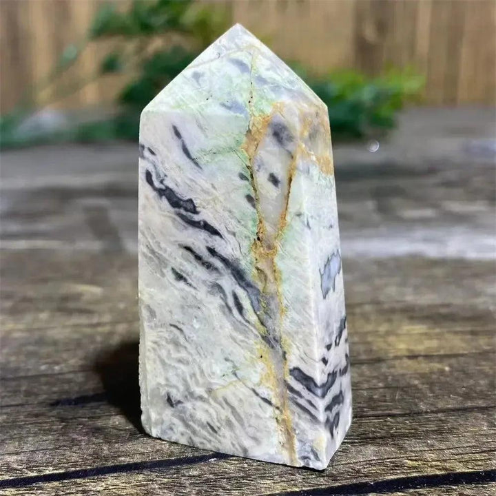 Picasso Stone Crystal Tower: grounding root chakra stone with bold black brushstrokes on warm cream and tan.