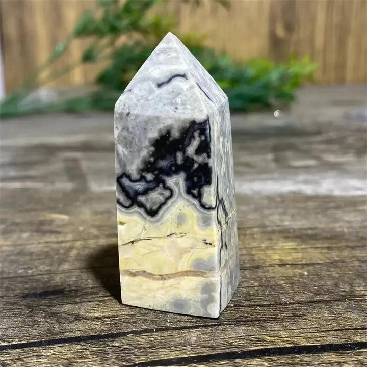 Picasso Stone Crystal Tower: grounding root chakra stone with bold black brushstrokes on warm cream and tan.