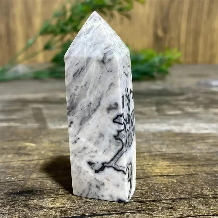 Picasso Stone Crystal Tower with bold black brushstrokes on warm cream, ideal for grounding and creativity.