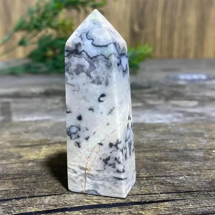 Picasso Stone Crystal Tower: grounding root chakra stone with bold black brushstrokes on warm cream and tan.