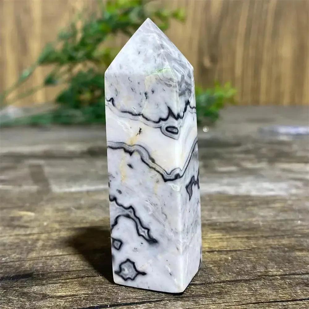 Picasso Stone Crystal Tower: grounding root chakra stone with bold black brushstrokes on warm cream, hand-polished.