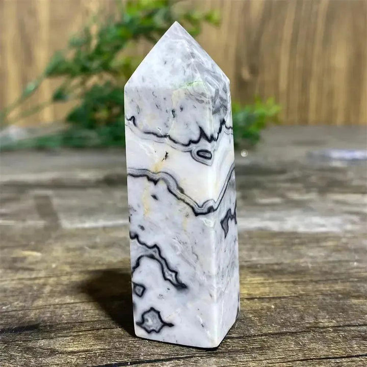Picasso Stone Crystal Tower: grounding root chakra stone with bold black brushstrokes on warm cream, hand-polished.
