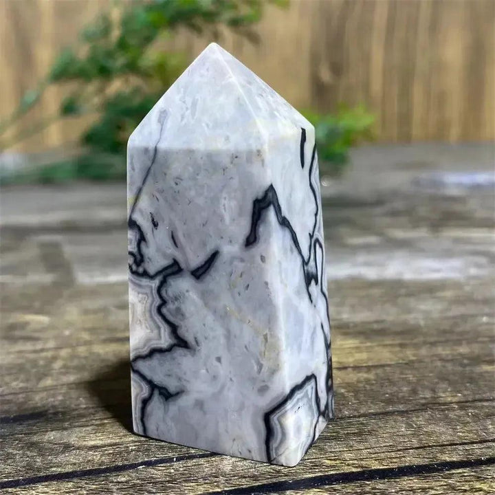 Picasso Stone Crystal Tower: grounding root chakra stone with bold black brushstrokes on warm cream, hand-polished.