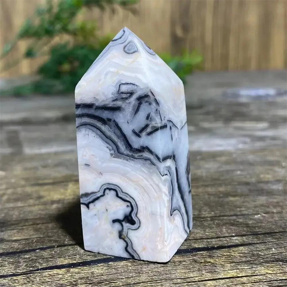 Picasso Stone Crystal Tower: grounding root chakra stone with bold black brushstrokes on warm cream, hand-polished.