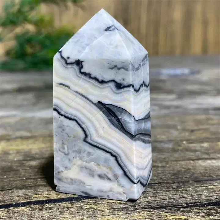 Picasso Stone Crystal Tower: grounding root chakra stone with bold black brushstrokes on warm cream and tan.
