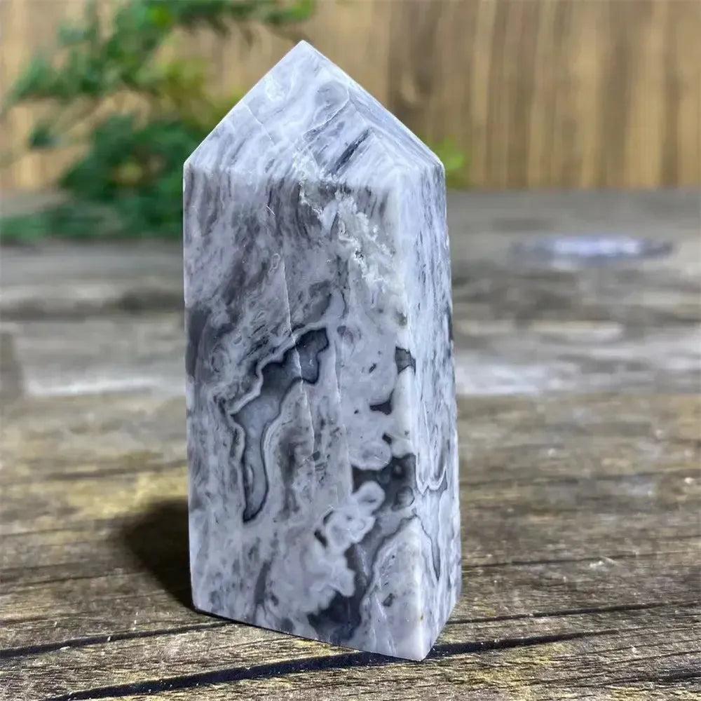 Picasso Stone Crystal Tower with bold black brushstrokes on a warm cream base for grounding and creativity.