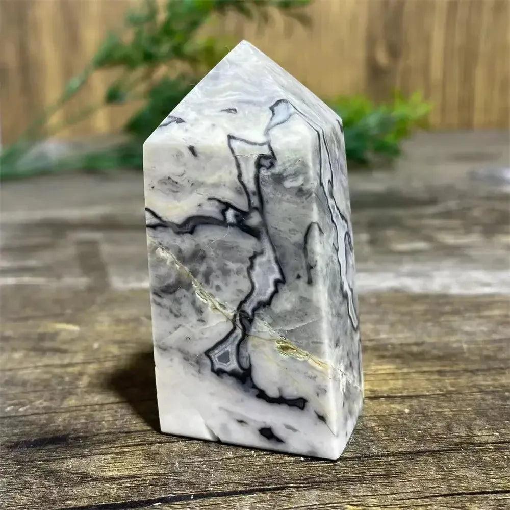 Picasso Stone Crystal Tower: grounding root chakra stone with bold black brushstrokes on warm cream and tan.