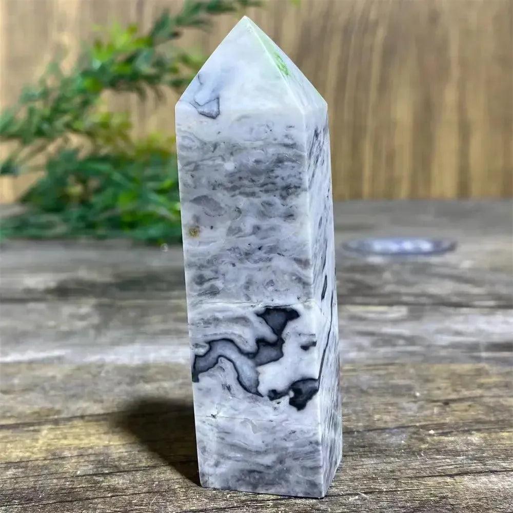 Picasso Stone Crystal Tower: grounding root chakra stone with bold black brushstrokes on warm cream.