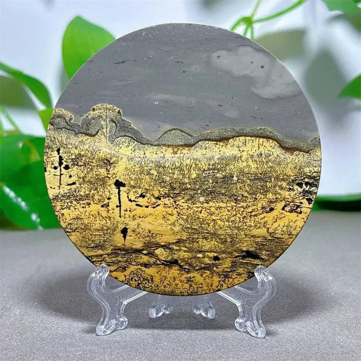Round Picture Jasper crystal slice with desert landscape patterns in cream, ochre, and deep brown, on a clear display stand from Crystal Destiny.