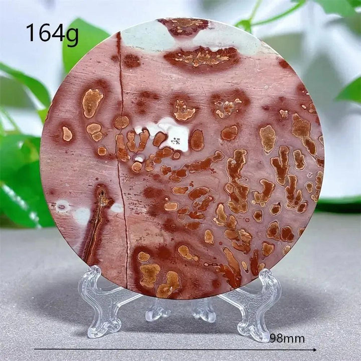 Round Picture Jasper crystal slice with earthy red, brown, and cream patterns on a clear stand from Crystal Destiny.