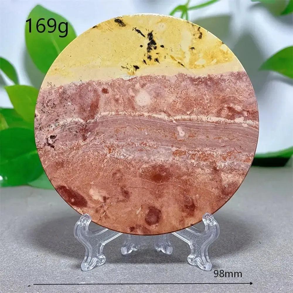 Round Picture Jasper crystal slice from Crystal Destiny, featuring earthy cream, ochre, and deep brown landscape patterns on a clear stand.