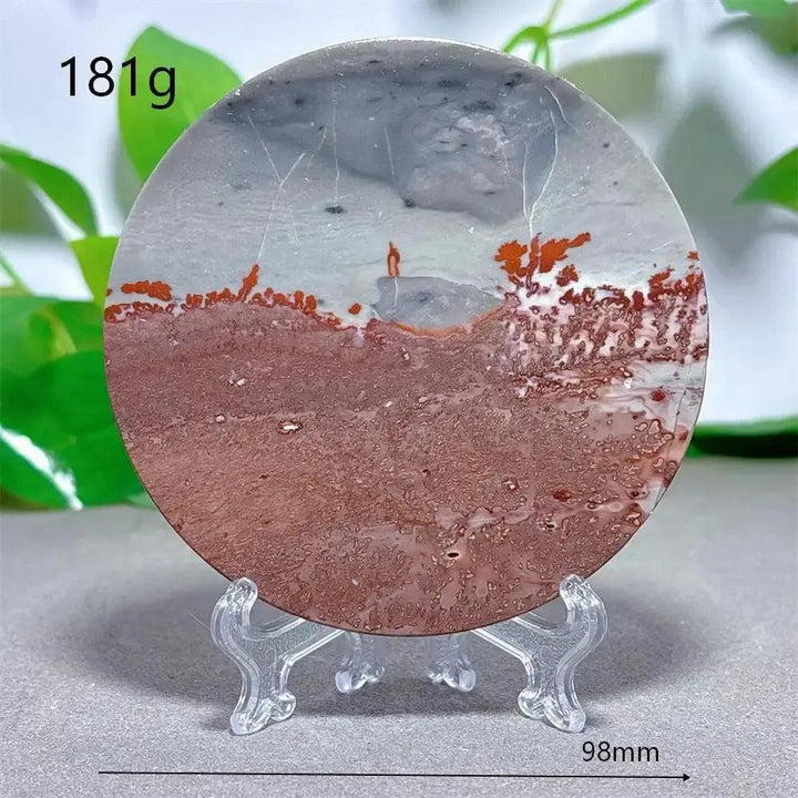 Crystal Destiny's Picture Jasper slice, a natural stone with landscape patterns in cream, ochre, and deep brown, on a stand.