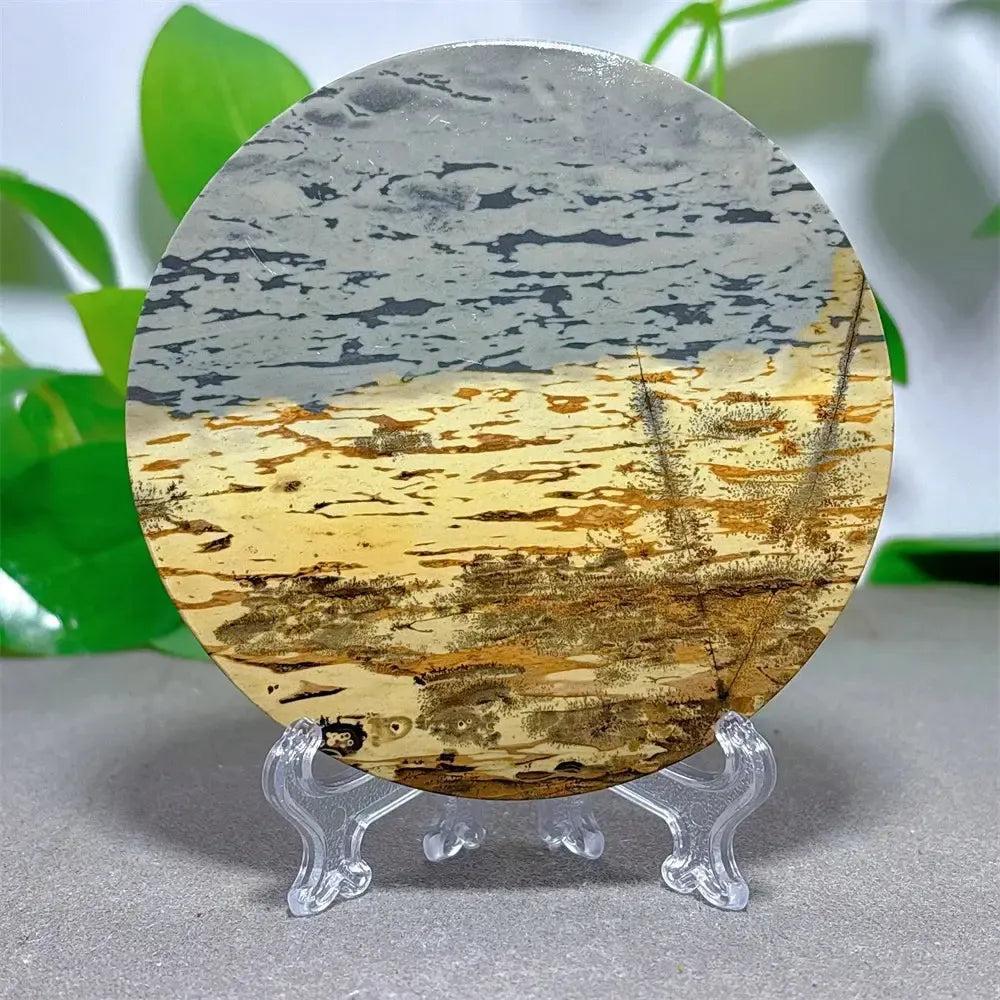Polished Picture Jasper crystal slice with natural landscape patterns in cream, ochre, and deep brown on a clear stand from Crystal Destiny.