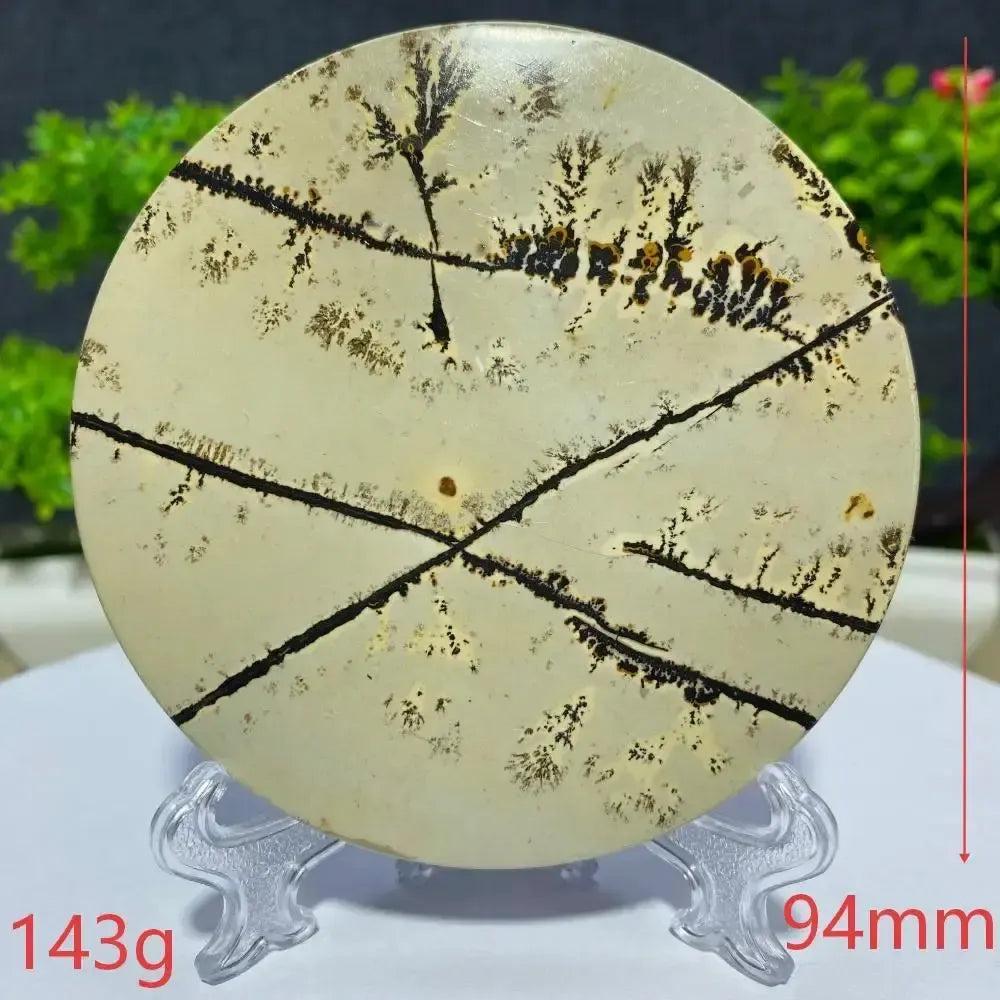 Crystal Destiny's 94mm, 143g round Picture Jasper slab, displaying unique black and brown landscape patterns on a cream background.