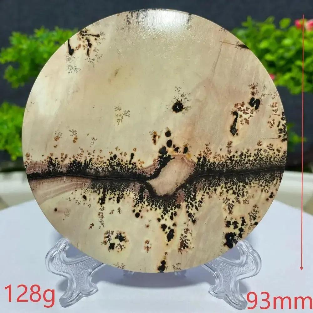 Round Picture Jasper slab from Crystal Destiny, featuring natural landscape patterns in cream, brown, and black.