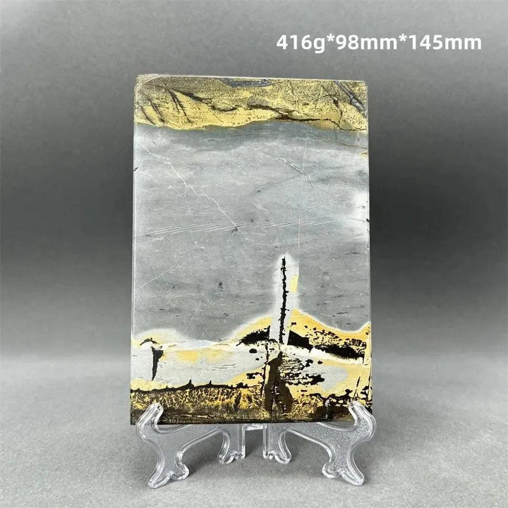 Polished Picture Jasper slice with natural landscape patterns in grey, ochre, and brown, on a clear stand from Crystal Destiny.
