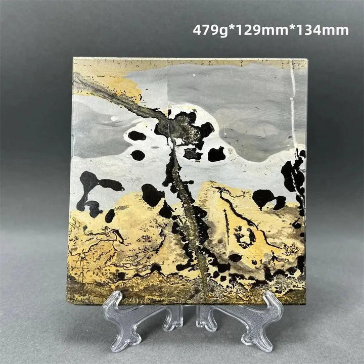 Polished Picture Jasper slice with unique landscape patterns in ochre, brown, and grey on a clear stand from Crystal Destiny.