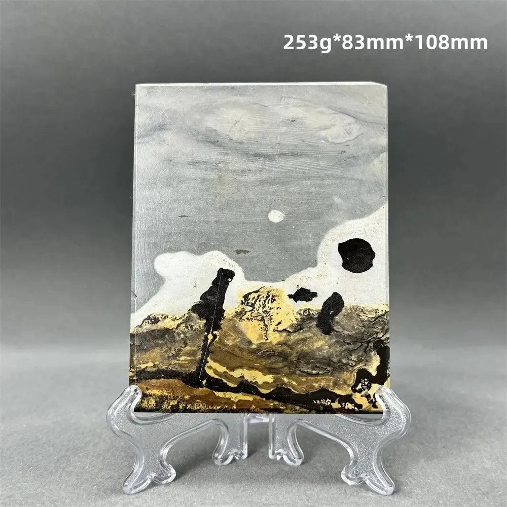 Polished Picture Jasper slice with natural landscape patterns in grey, cream, ochre, and brown, on a clear stand from Crystal Destiny.