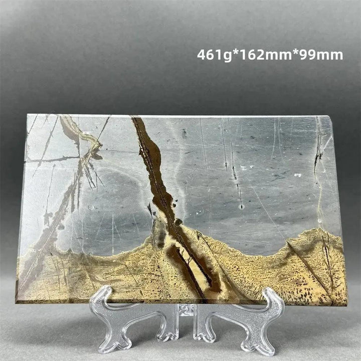 Polished Picture Jasper slice with unique landscape patterns in grey, brown, and tan, on a clear stand from Crystal Destiny.