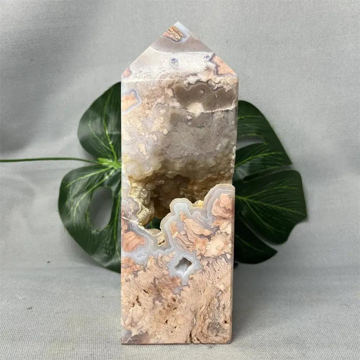 Pink Agate geode crystal tower from Crystal Destiny, featuring a polished exterior with raw druzy cave.