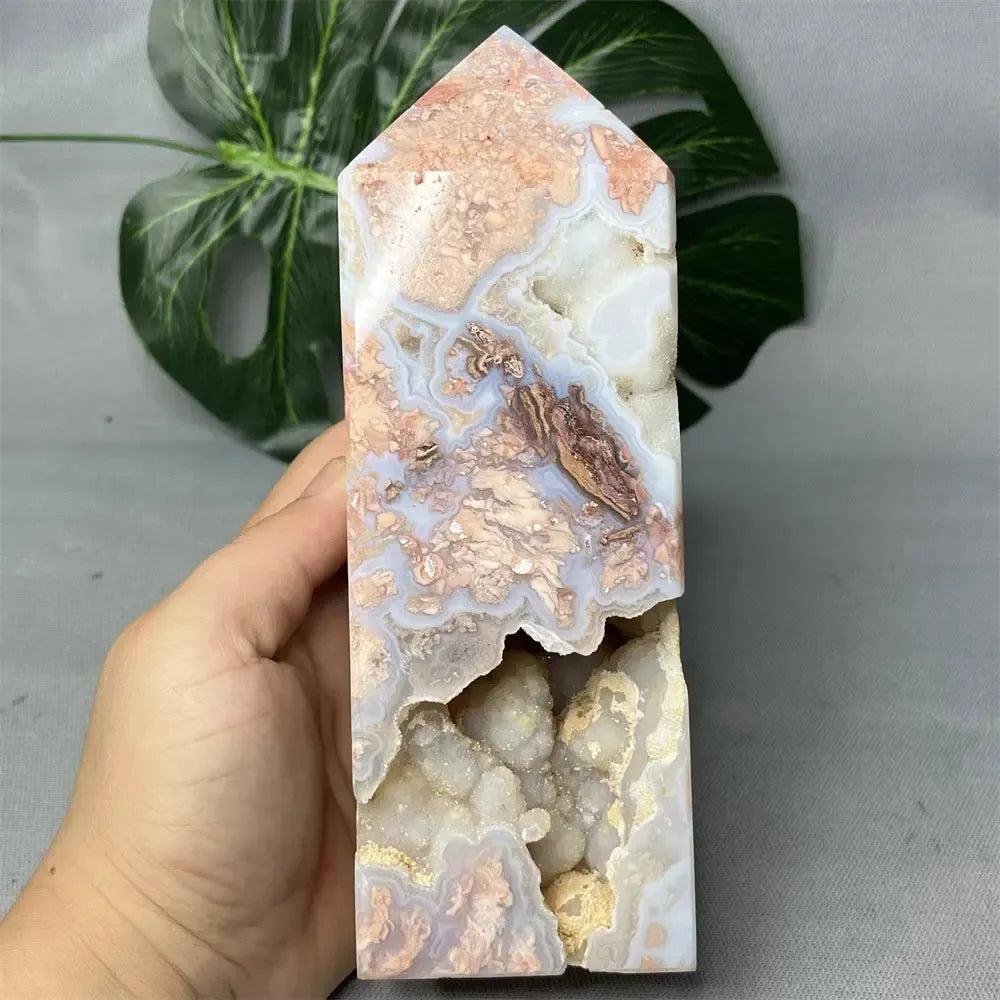 Pink Agate geode crystal tower from Crystal Destiny, featuring a polished exterior, raw druzy cave, and soft pink hues.