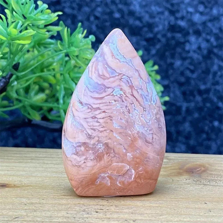 Hand-polished pink agate geode torch from Crystal Destiny, showcasing blush, cream, and dusty rose bands for emotional balance.