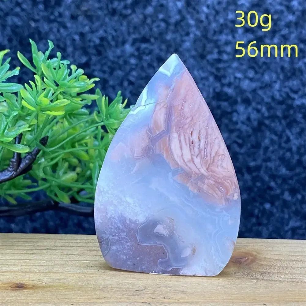 Hand-polished Pink Agate geode specimen from Crystal Destiny, a teardrop-shaped crystal with blush and cream bands.