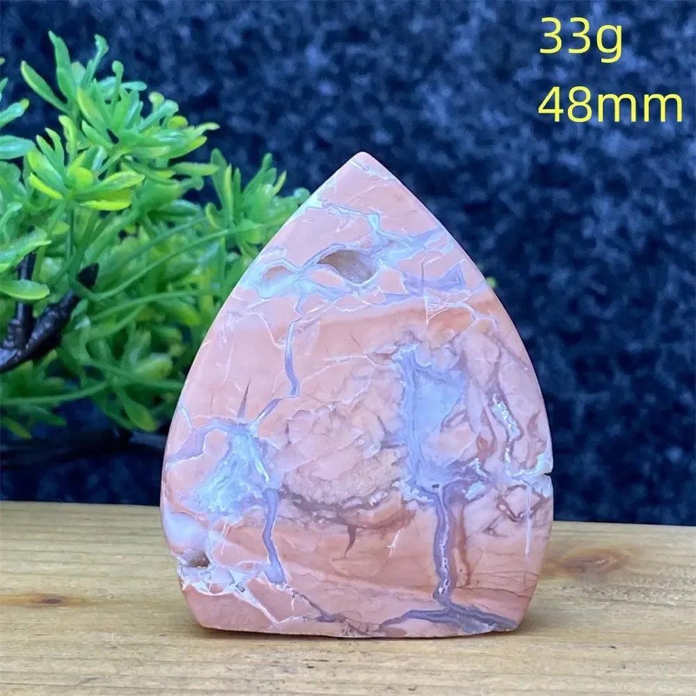 Hand-polished pink agate geode torch specimen from Crystal Destiny, showcasing blush and cream banding for emotional balance.