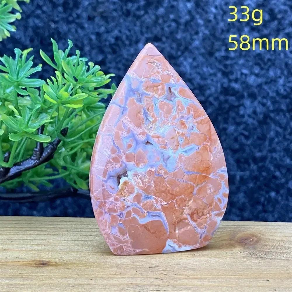 Pink Agate teardrop cabochon from Crystal Destiny, featuring natural blush, cream, and dusty rose banding.