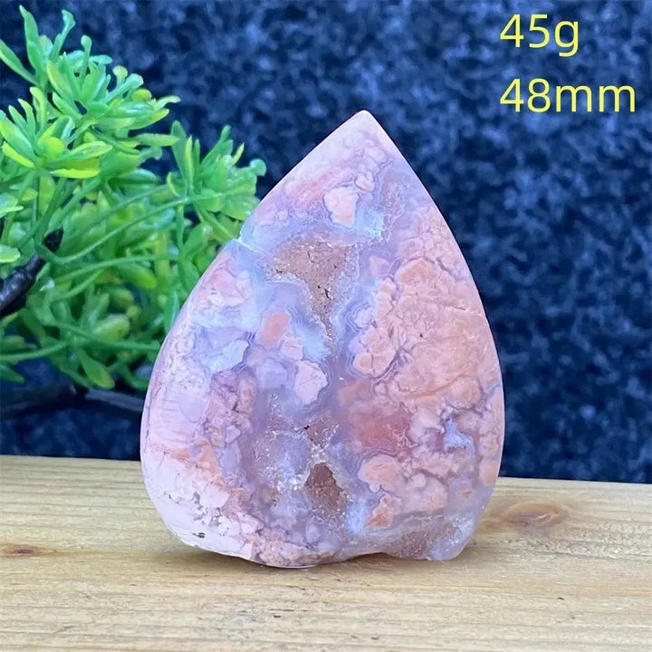 Hand-polished Pink Agate geode torch from Crystal Destiny, showcasing blush and cream layers for emotional balance.