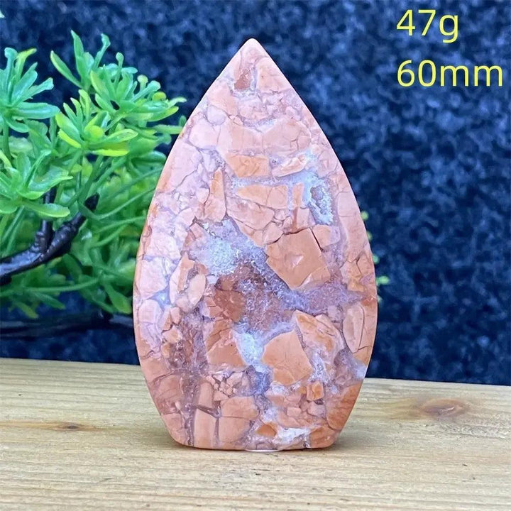 Crystal Destiny's 47g, 60mm teardrop Pink Agate crystal, hand-polished with unique blush and cream banding.