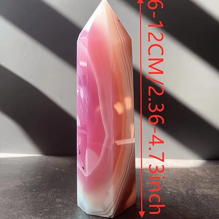 Vibrant pink agate pillar crystal point, a healing bohemian home decoration ornament.