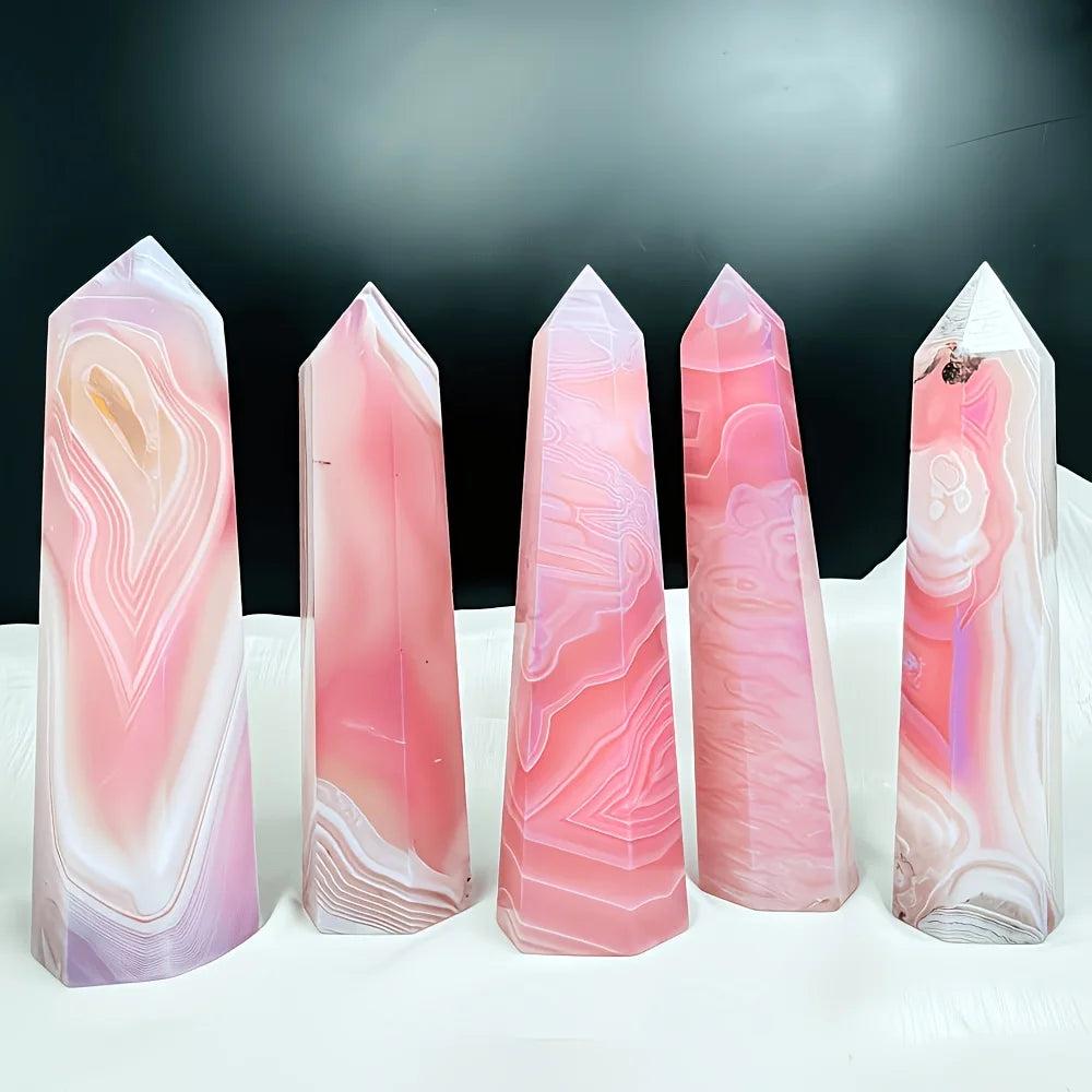 Polished pink agate pillar crystals with natural banded patterns for healing and bohemian home decor.