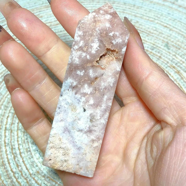 Hand-held Pink Amethyst Druzy Tower featuring soft lavender quartz, white banding, and a sparkling crystal pocket.