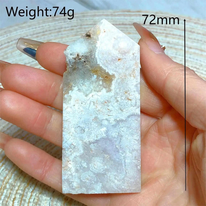Hand-held Pink Amethyst Druzy Tower with sparkling lavender quartz, white banding, and a polished faceted point.