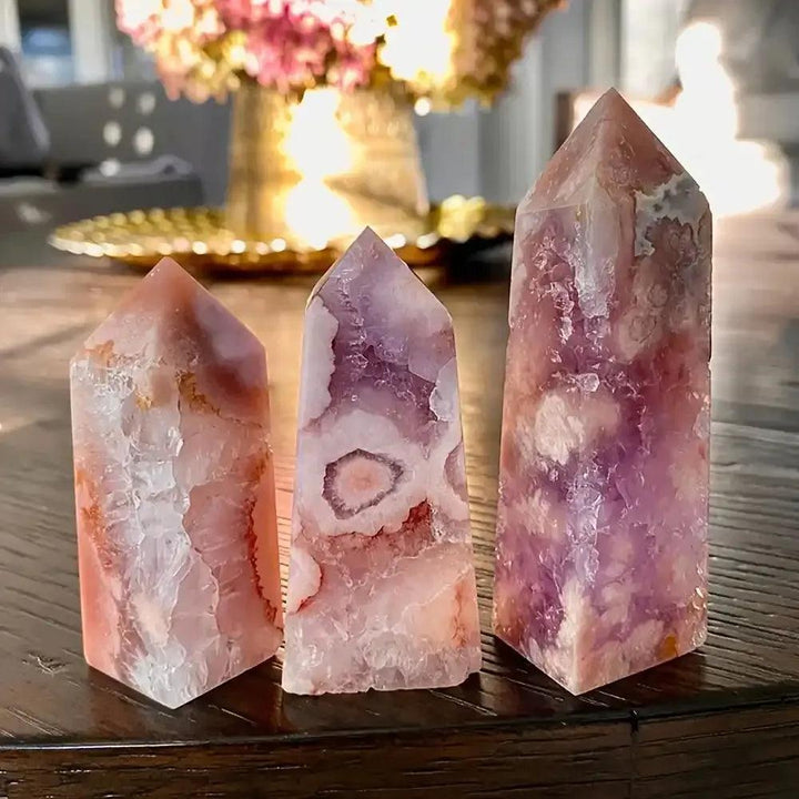 Three hand-polished Pink Amethyst towers with soft lavender quartz, white banding, and faceted points for heart healing.