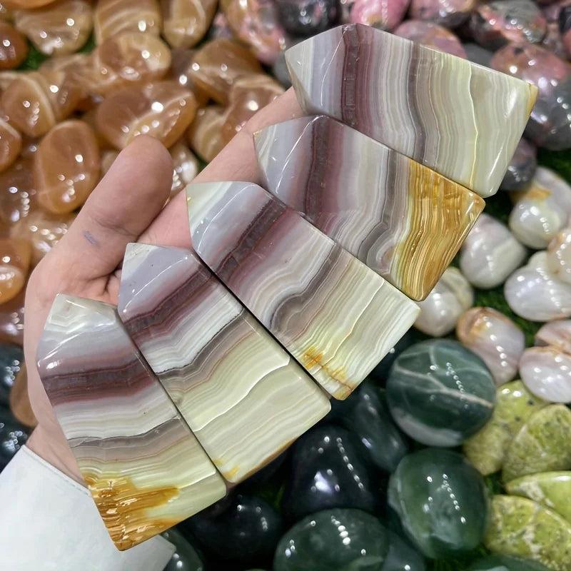 Pink Banded Calcite Crystal Towers with soothing pink, peach, and cream layers for heart healing.