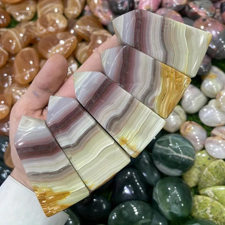 Pink Banded Calcite Crystal Towers with soothing pink, peach, and cream layers for heart healing.