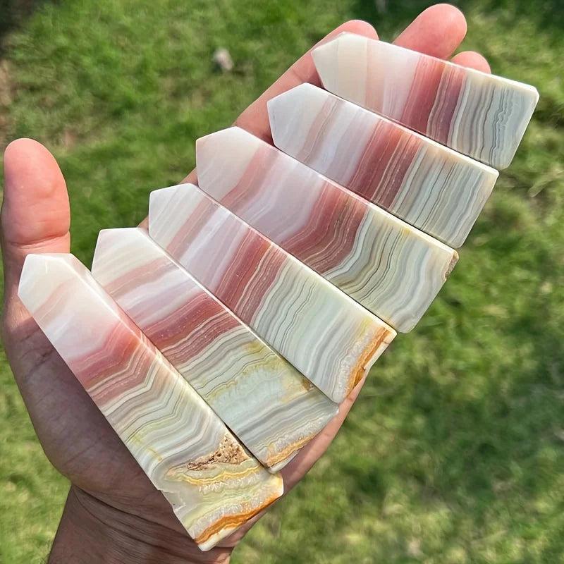 Pink Banded Calcite Crystal Towers with soothing pink, peach, and white healing bands.