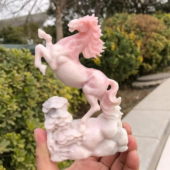 Hand-carved pink opal horse statue with a smooth, luminous finish for heart-centered healing and calm energy.