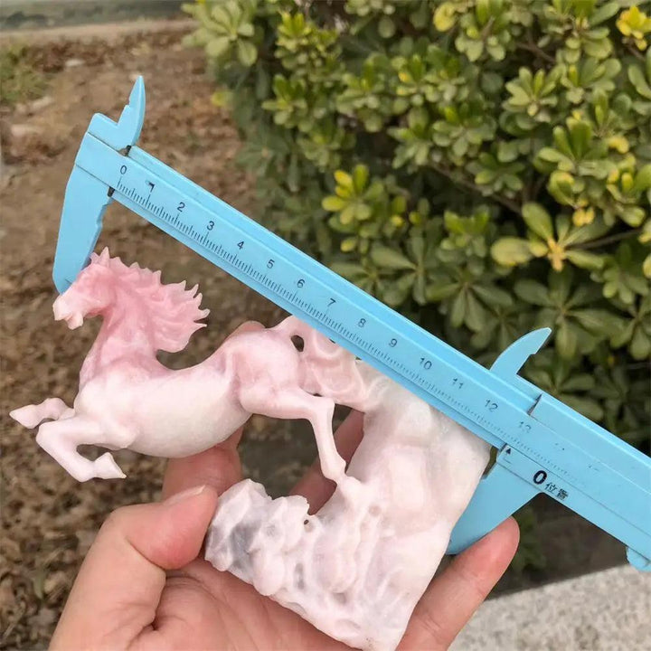 Hand-carved pink opal horse statue, a polished crystal sculpture for Heart Chakra healing and peaceful energy.
