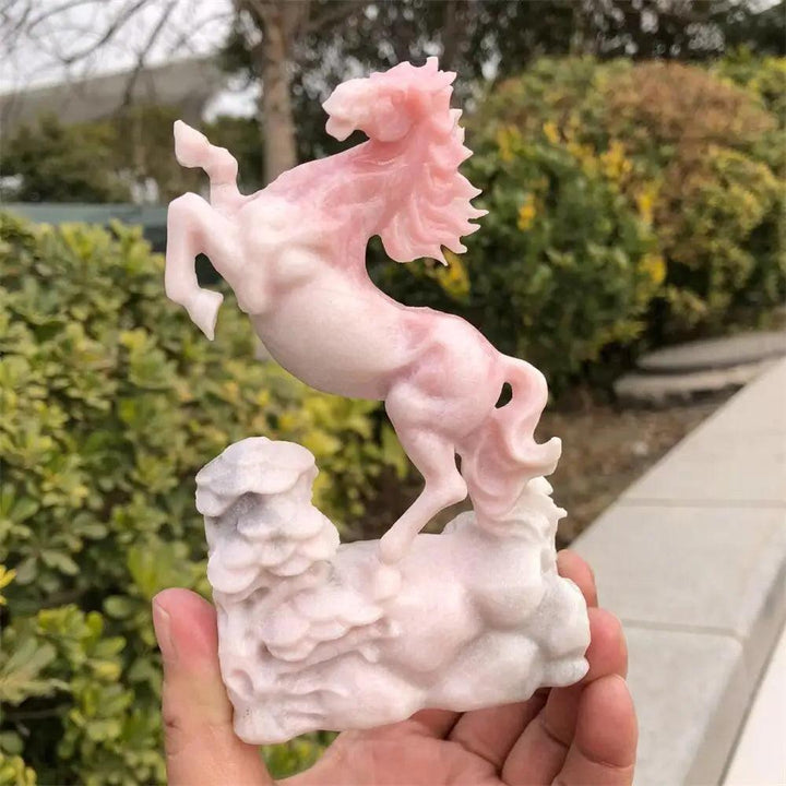 Hand-carved pink opal horse statue with a smooth, luminous finish, perfect for Heart Chakra healing and calm energy.