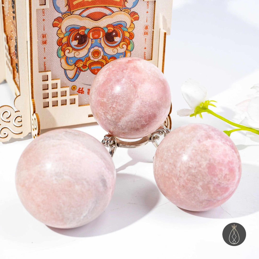 Polished Pink Opal spheres in blush and bubblegum pink, perfect for heart chakra healing and calming home decor.