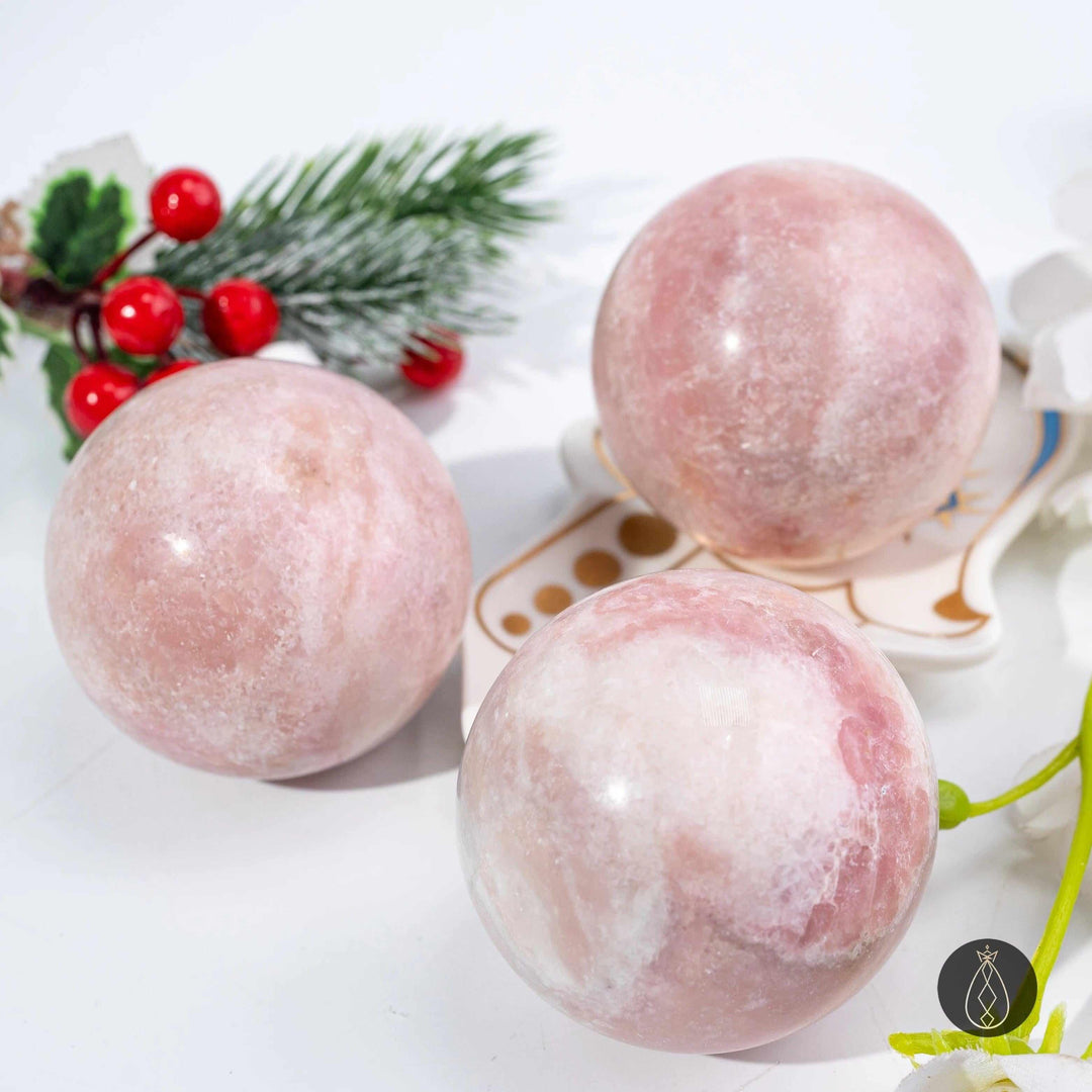 Polished pink opal spheres in blush and bubblegum tones, perfect for heart chakra healing and calming home decor.