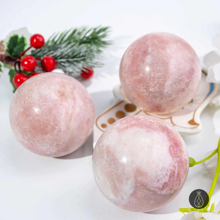 Polished pink opal spheres in blush and bubblegum tones, perfect for heart chakra healing and calming home decor.